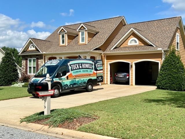 company van parked in front of house